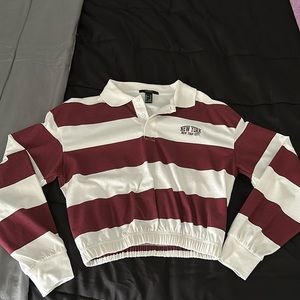 Small cropped shirt. No stains, never worn, no rips, ALL clean